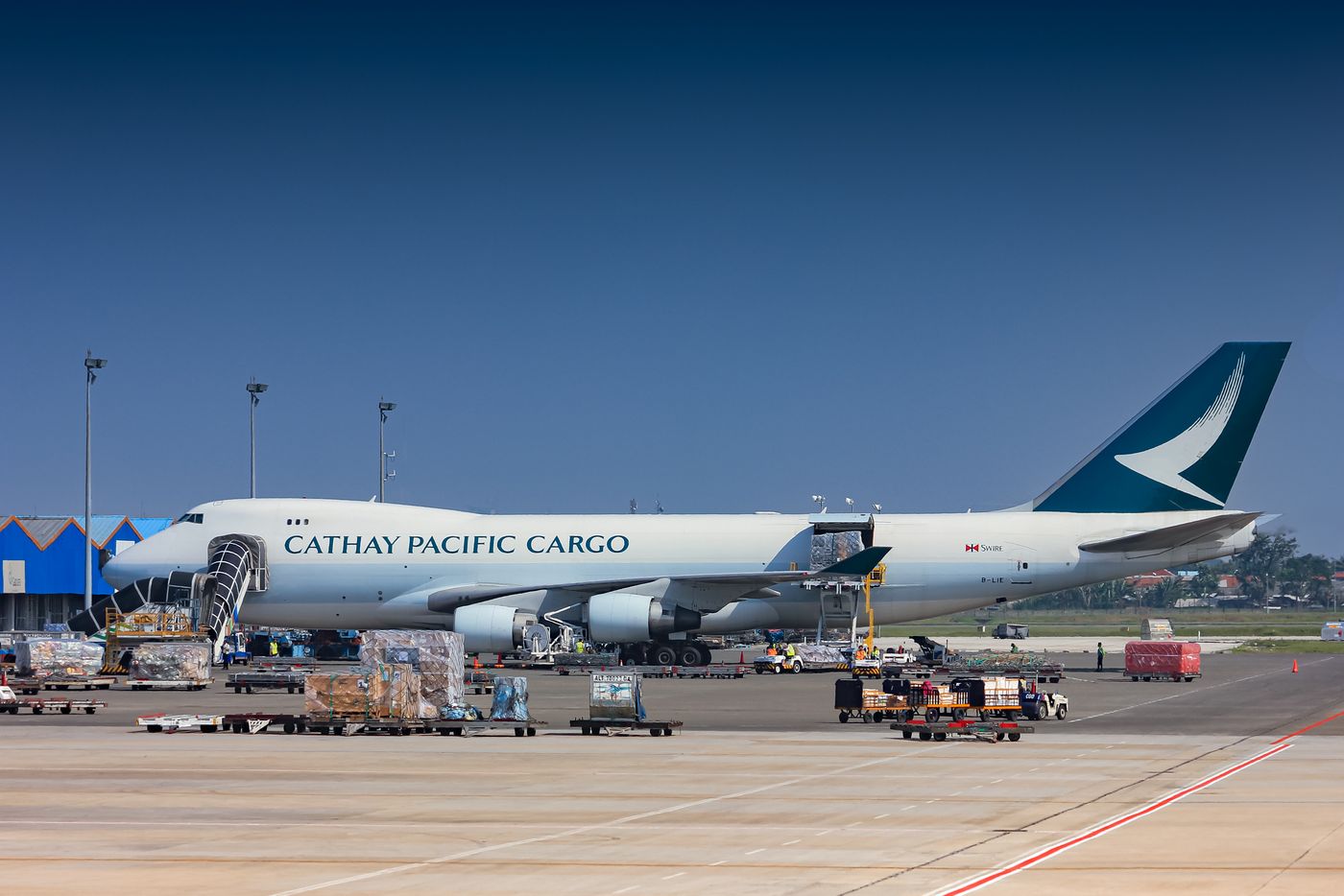 Cargo aircraft being loaded at an airport