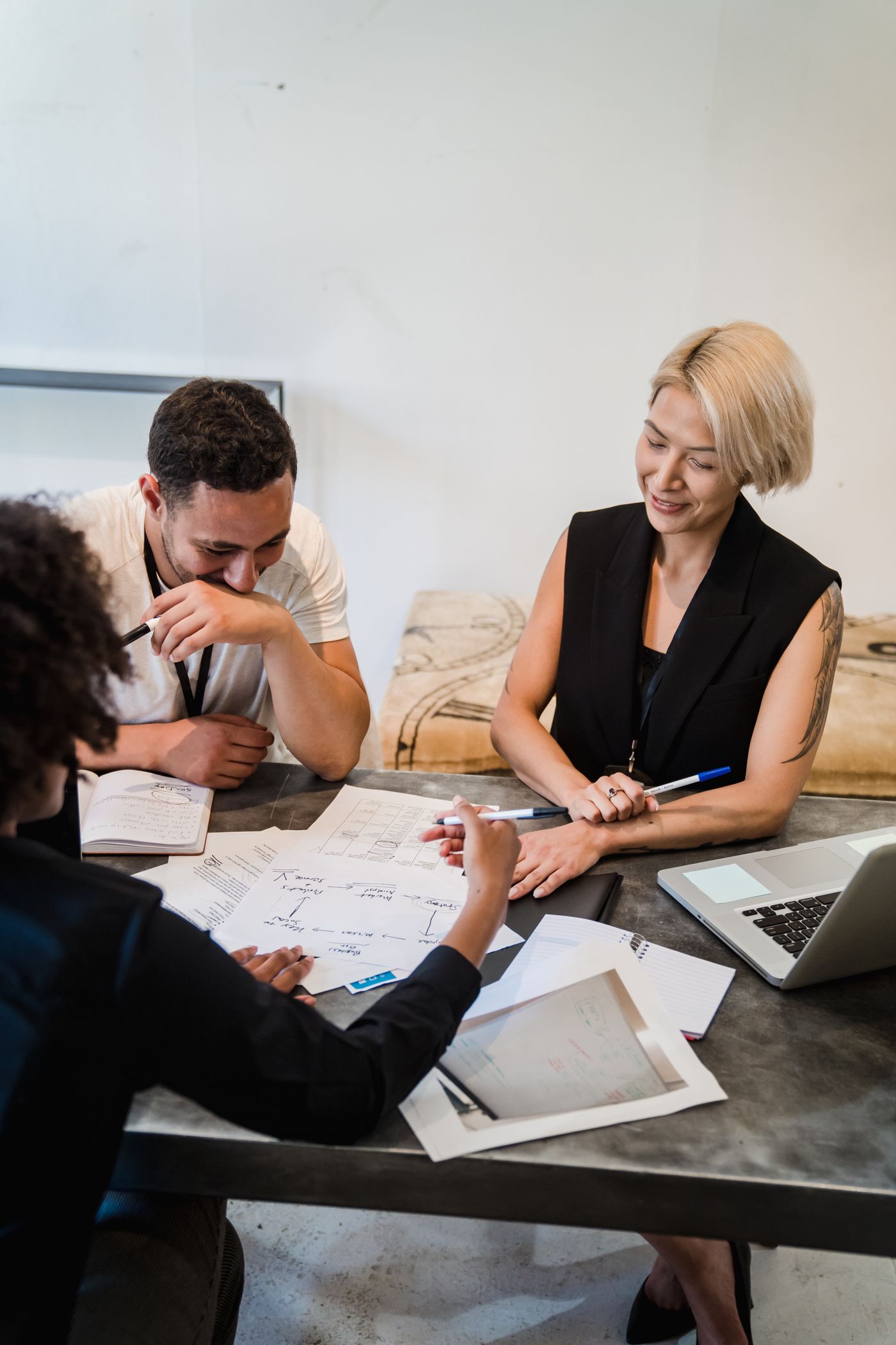 Illustrative photograph of professionals collaborating around a table