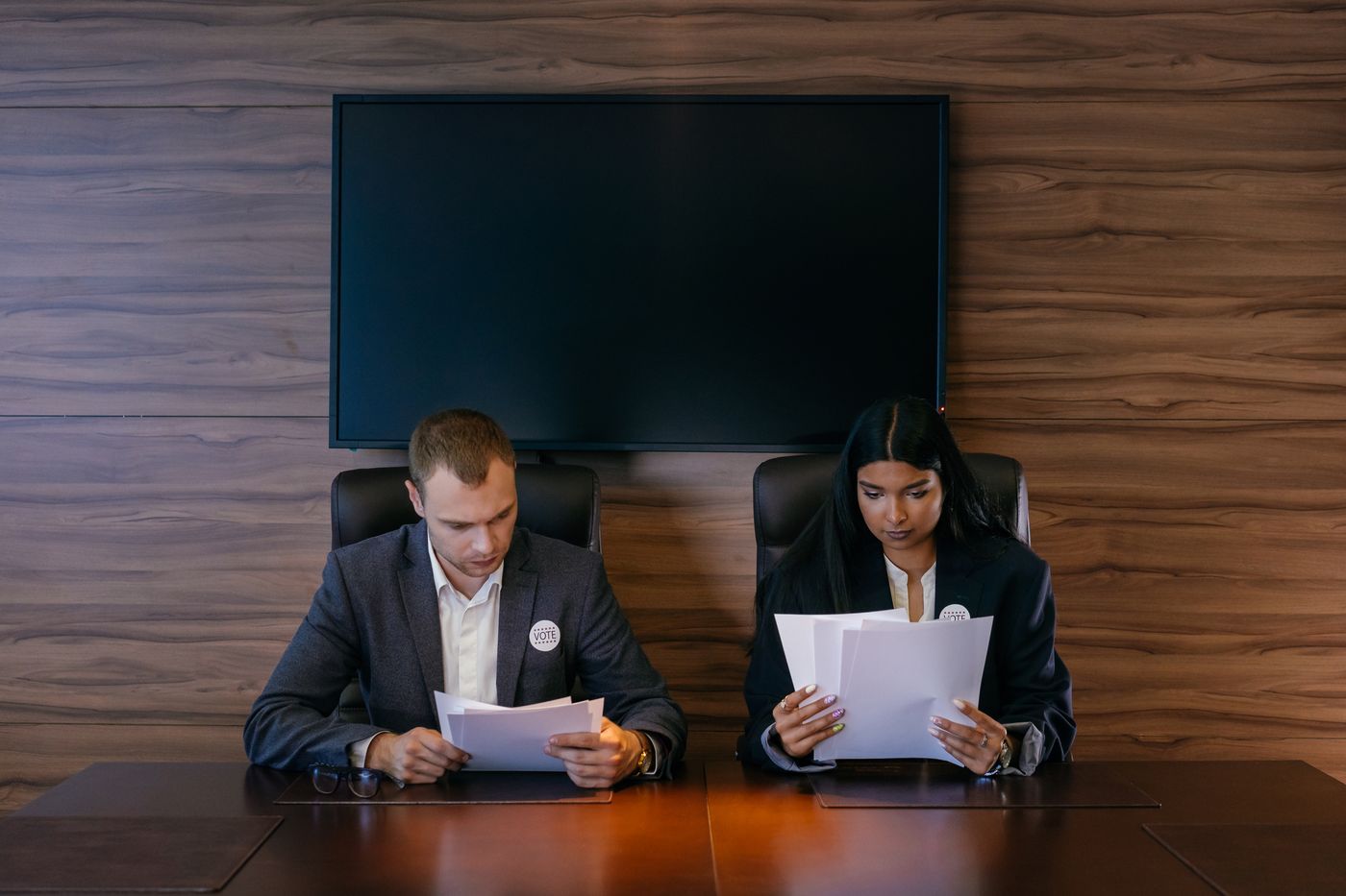 Professionals reviewing documents at a conference table