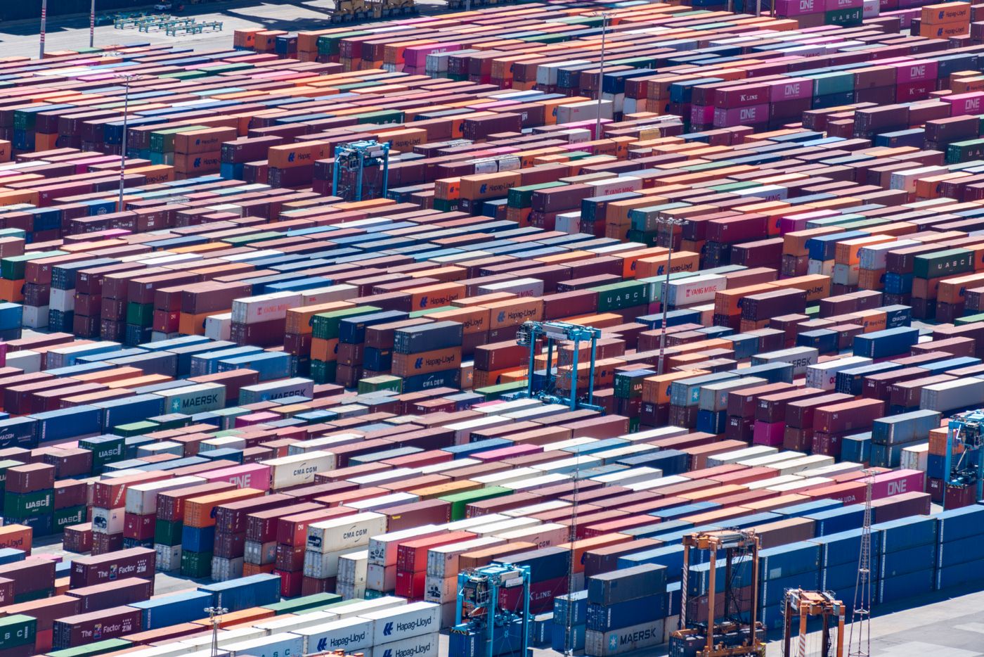 Aerial view of shipping containers and port machinery