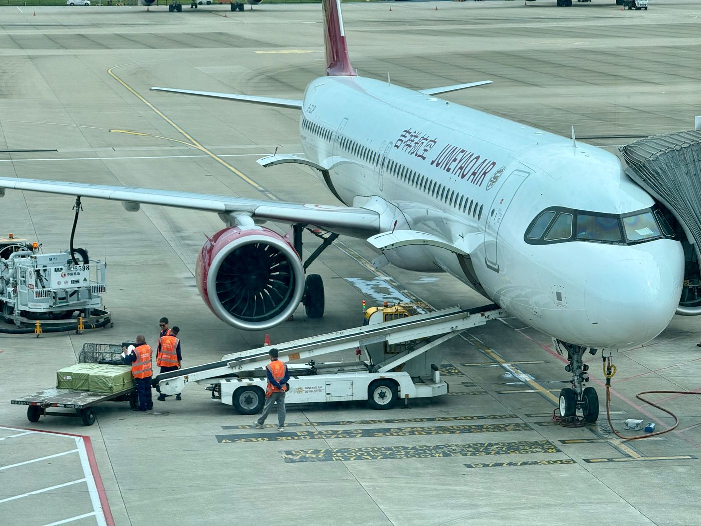 Ground crew loading cargo onto an aircraft