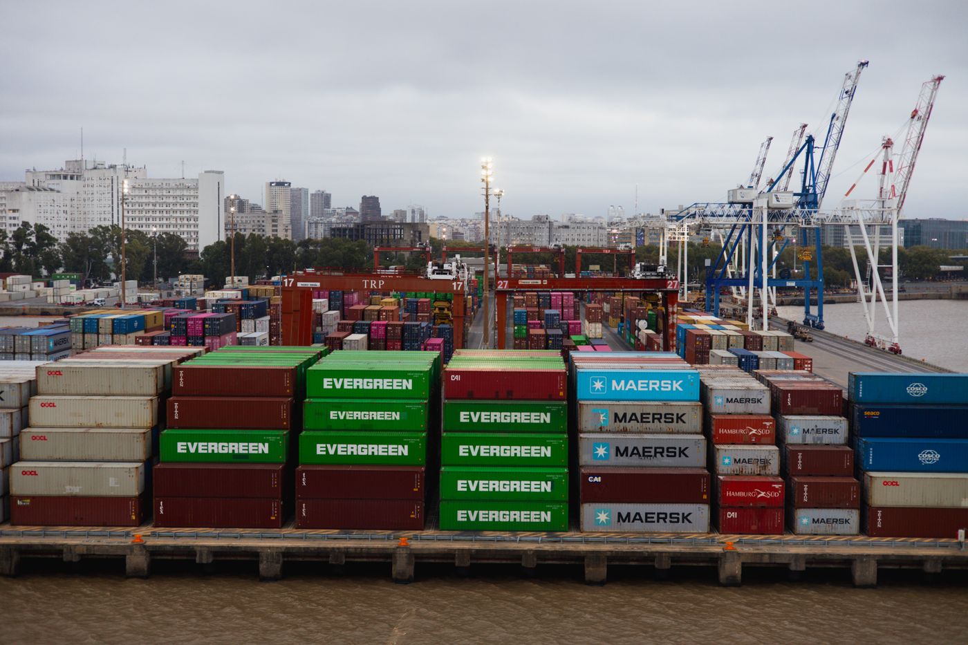 Cargo containers and cranes at a busy shipping port