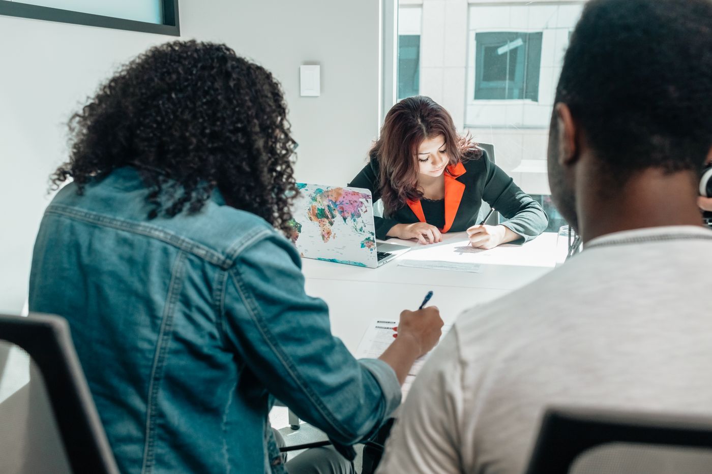 Professionals reviewing and completing documents