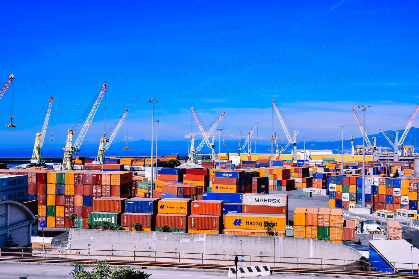 Shipping terminal with cranes and stacked containers